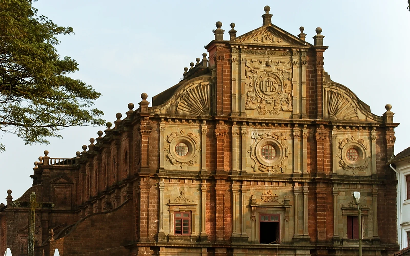 A palm-lined waterside landscape reflected in Goa; Goa Coast & Local Culture is customizable